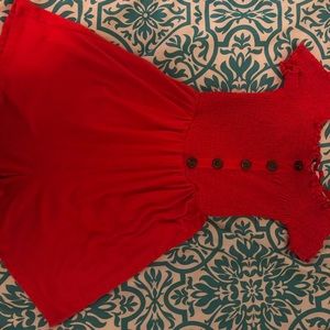 Red romper.